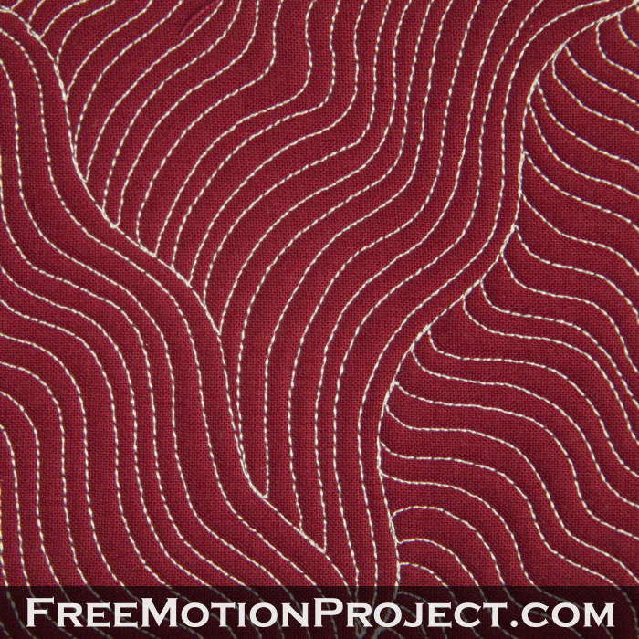 Free motion quilting wiggly woven lines