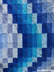 Learn how to piece and quilt a bargello quilt with Leah Day